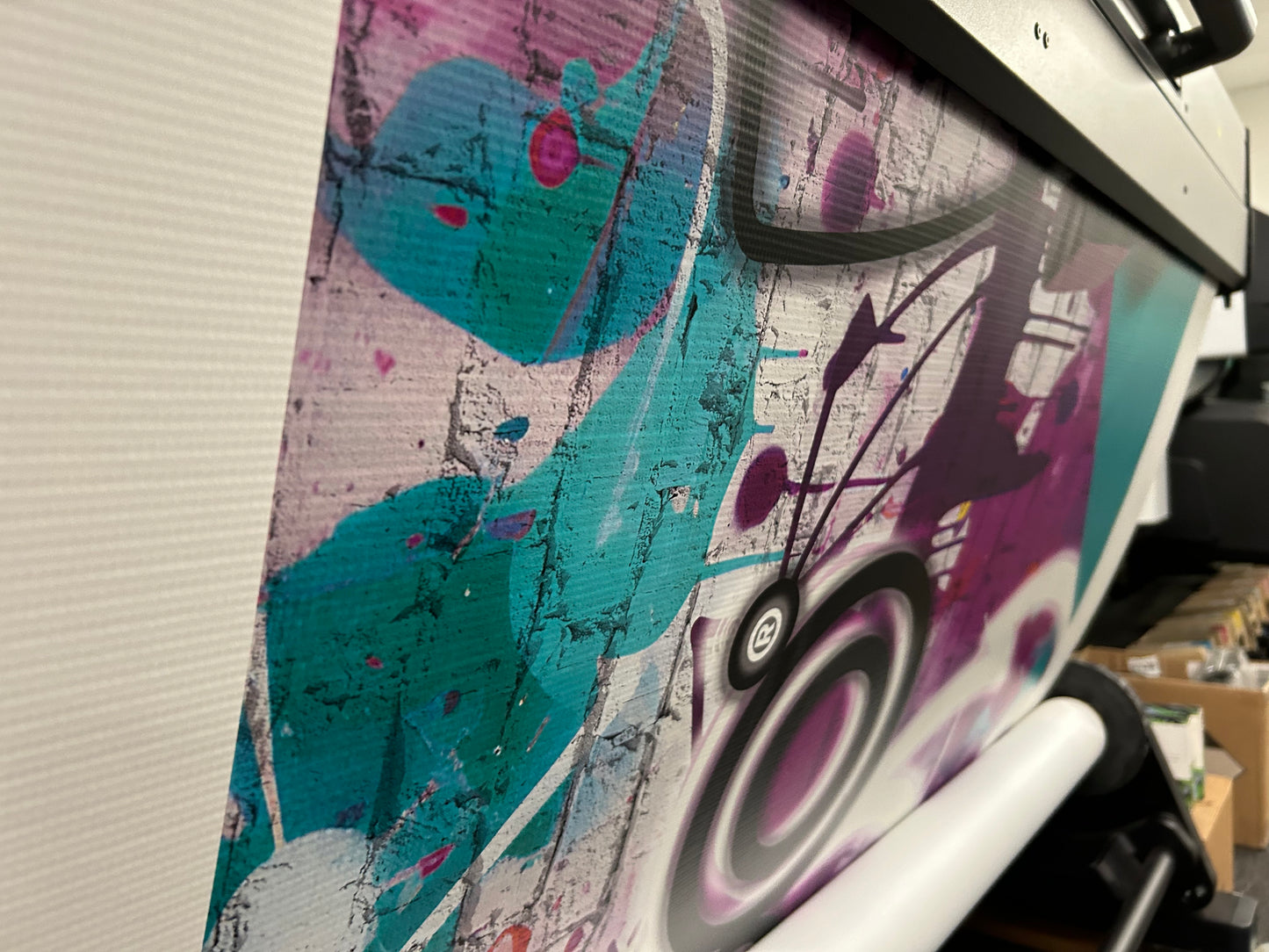 Colorful abstract design on a product with a speaker silhouette.