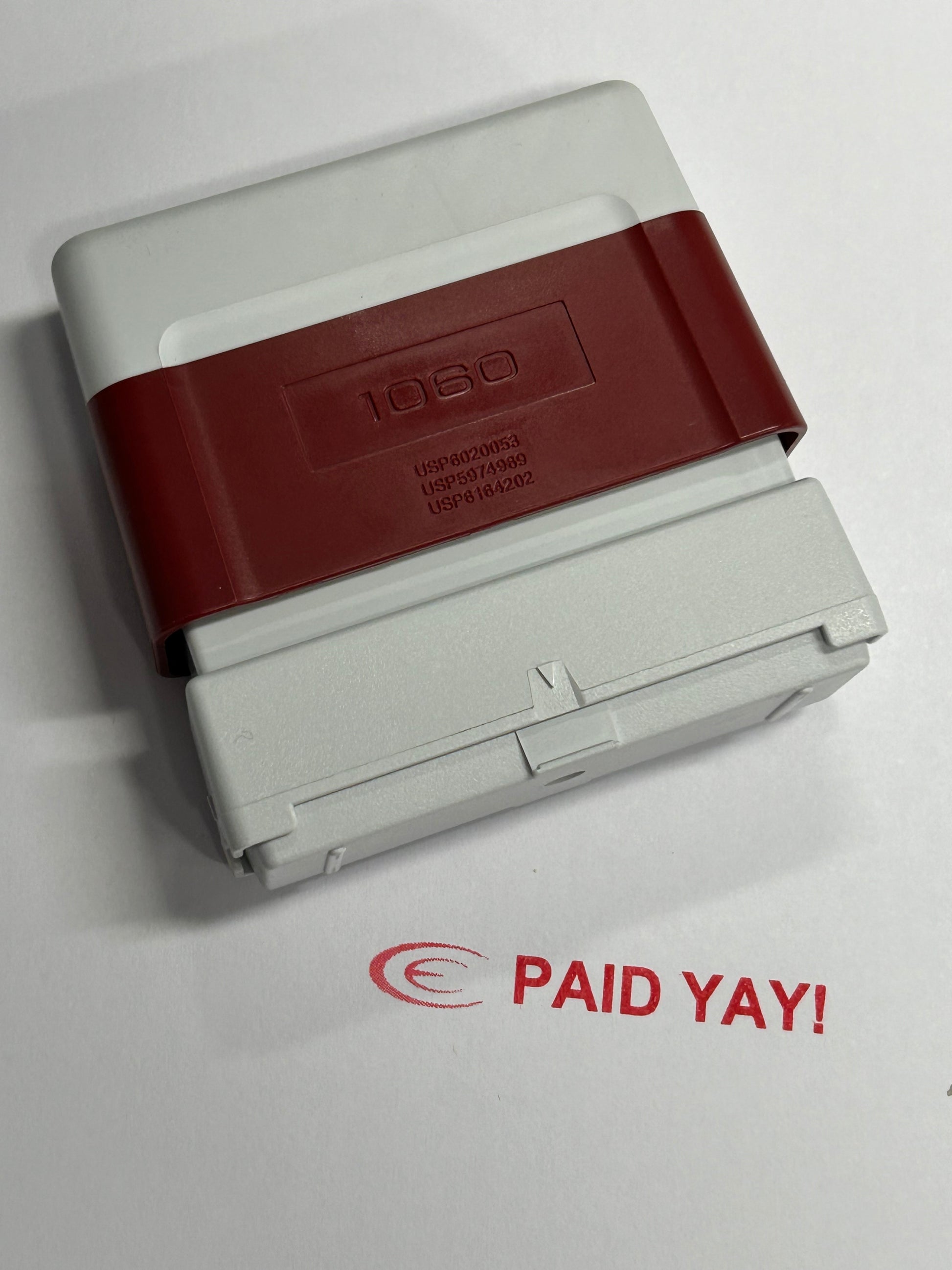 Brother 1060 red "Paid" stamp, ideal for marking invoices and documents. Customizable with clear, bold impressions for easy tracking of payments. Durable and efficient for frequent use in office or business settings.