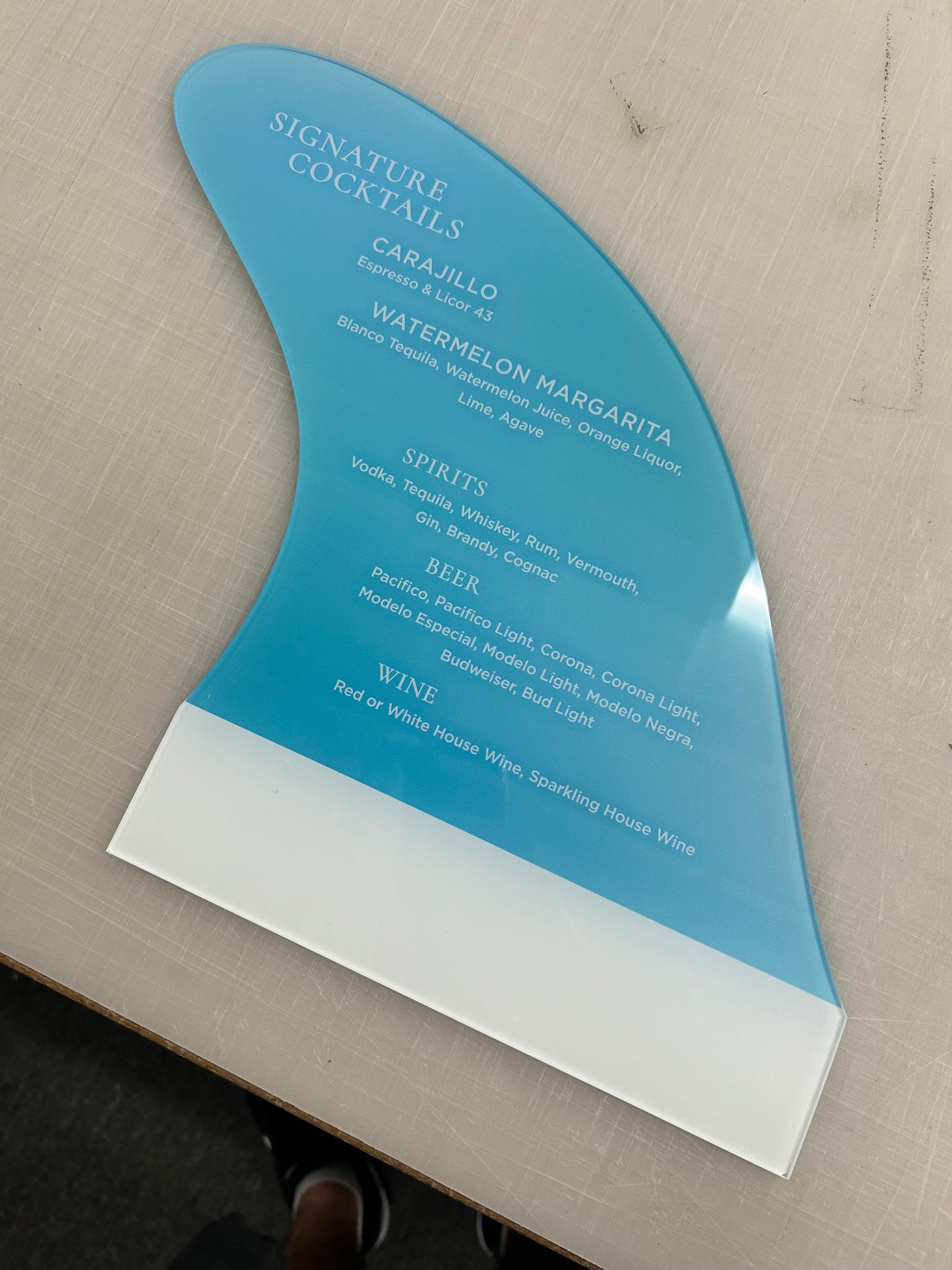 Blue and white menu on a wooden surface