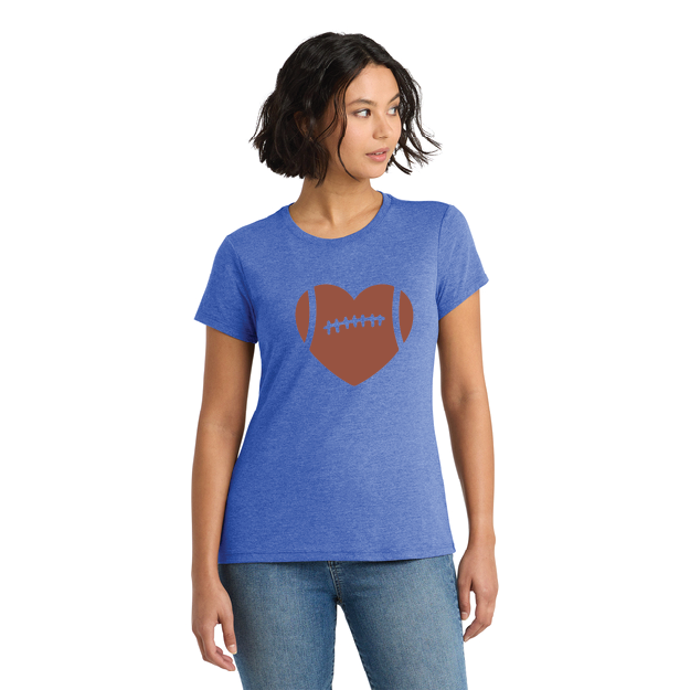 Woman wearing a blue t-shirt with a brown heart and football design on a white background