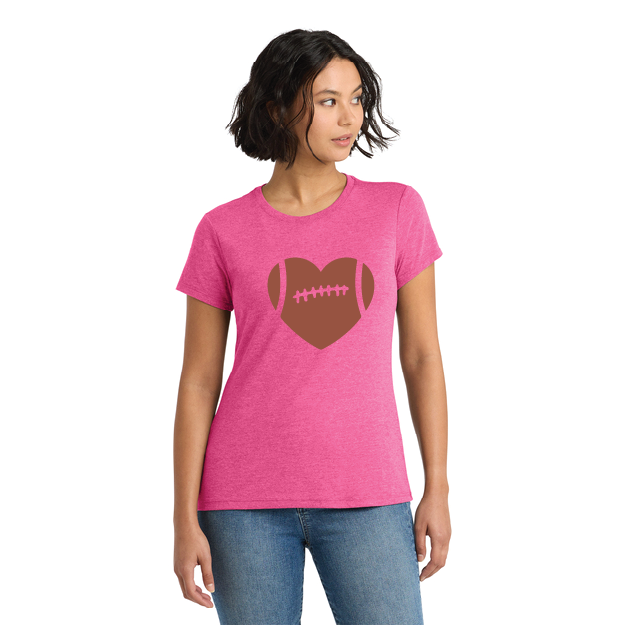 Woman wearing a pink t-shirt with a brown heart-shaped football design on a white background