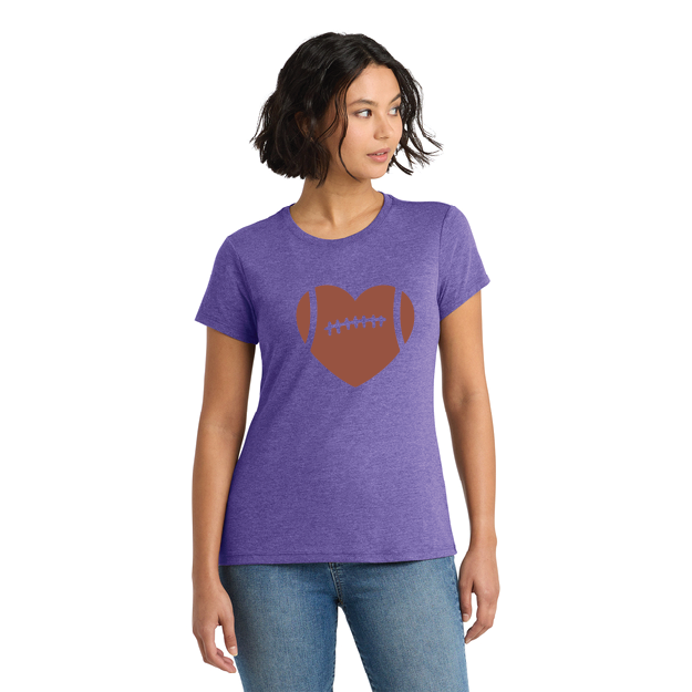 Woman wearing a purple t-shirt with a brown heart and football graphic on a white background