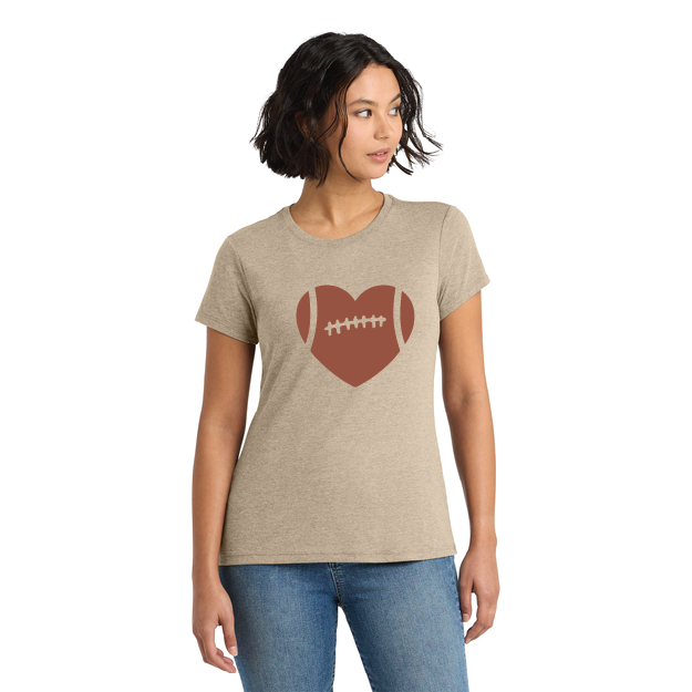 Woman wearing a beige t-shirt with a heart-shaped football design on a white background