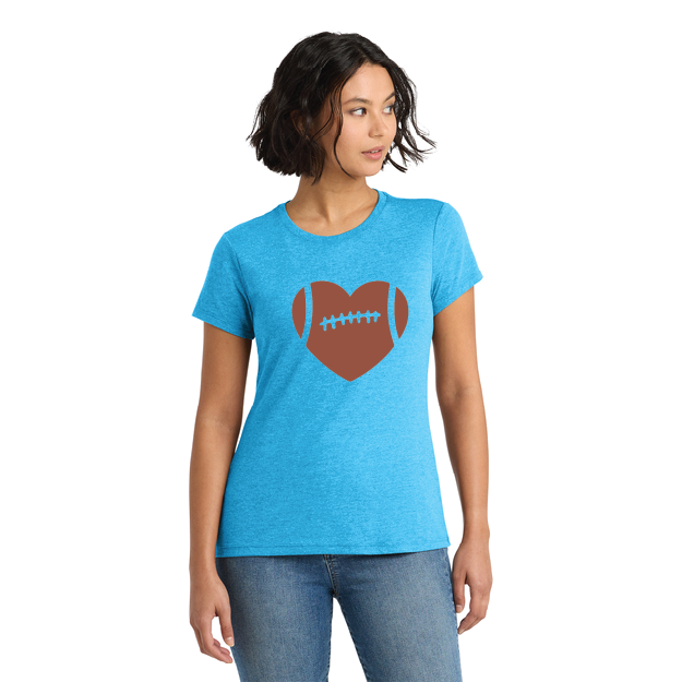 Woman wearing a blue t-shirt with a brown heart and football design on a white background
