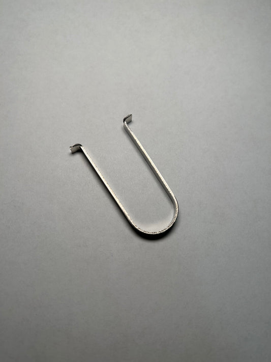 Metal hook on a gray background