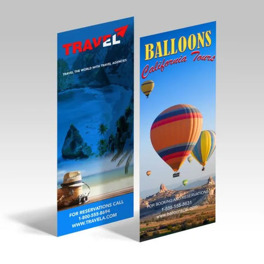 Two travel-themed posters, one with a beach scene and the other with hot air balloons, on a light gray background.