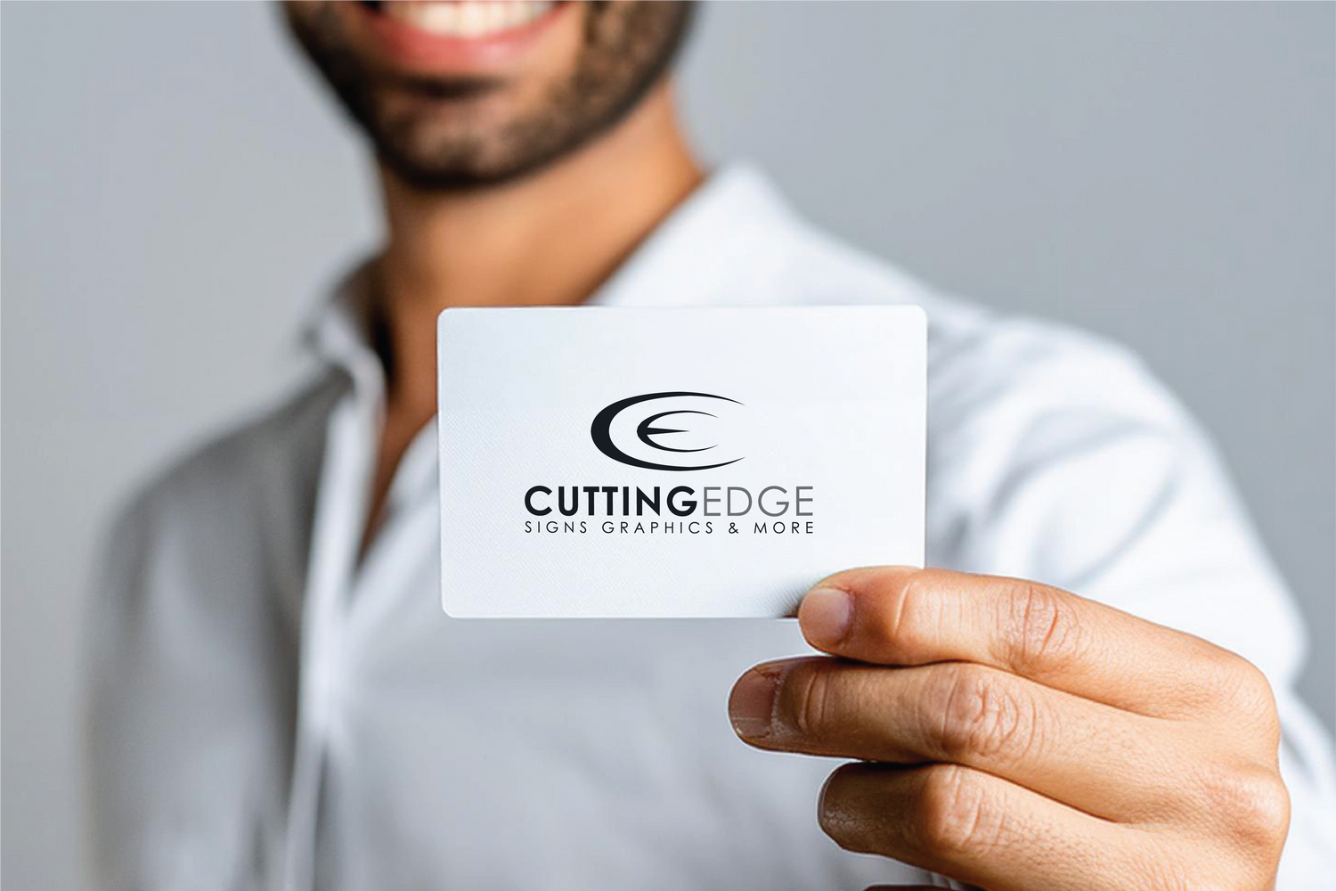 man holding business card