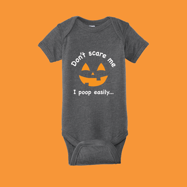 Gray baby onesie with Halloween design on an orange background