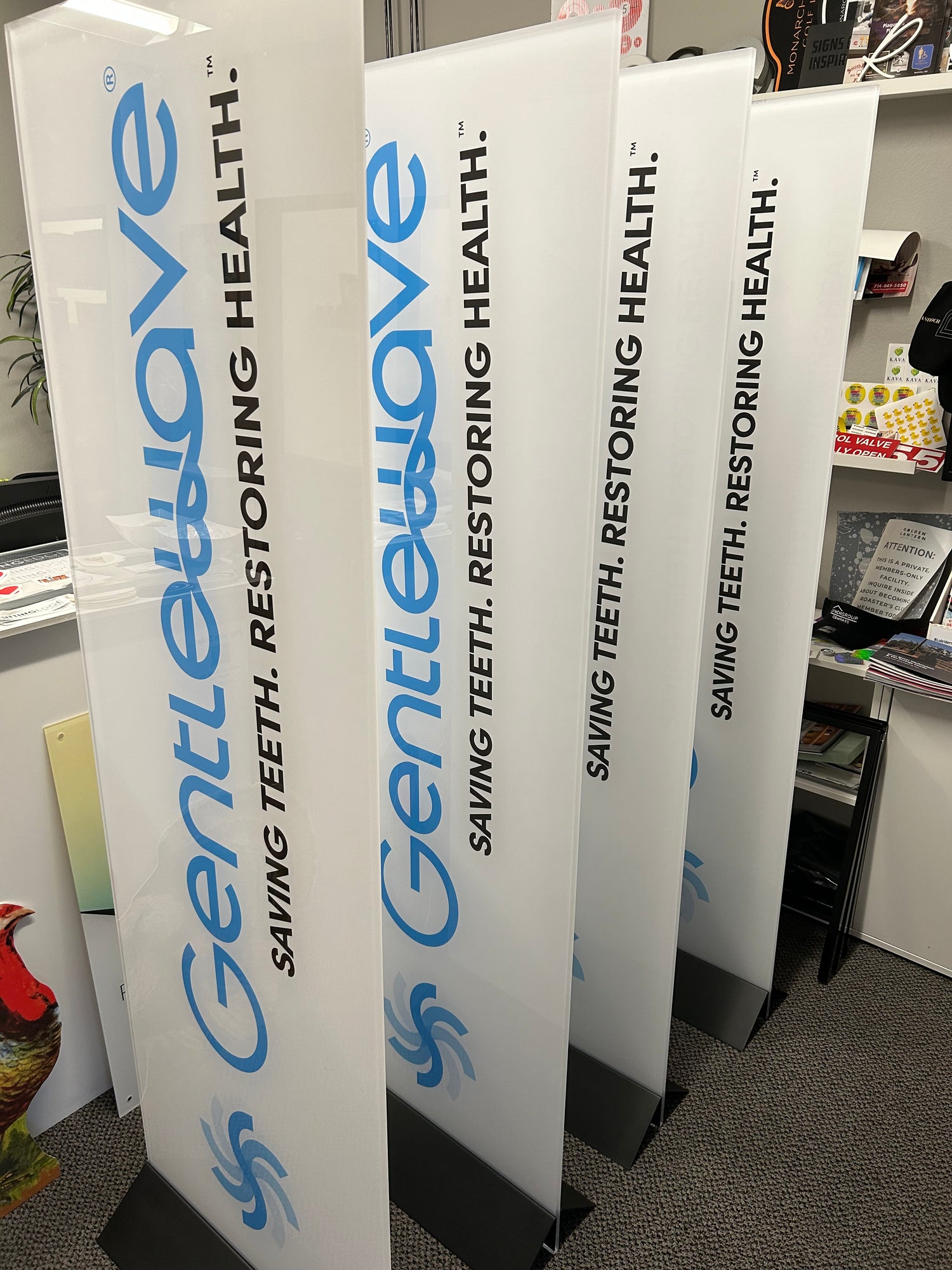 Stack of white cards with blue and black text on a gray surface