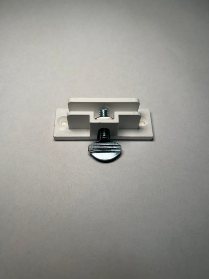 A single white PVC clip with two holes and an screw for perpendicular sign mounting on a grey background.