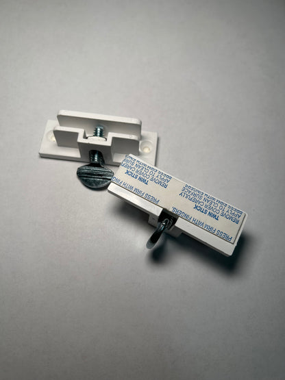 Metallic wall mount bracket on a gray background