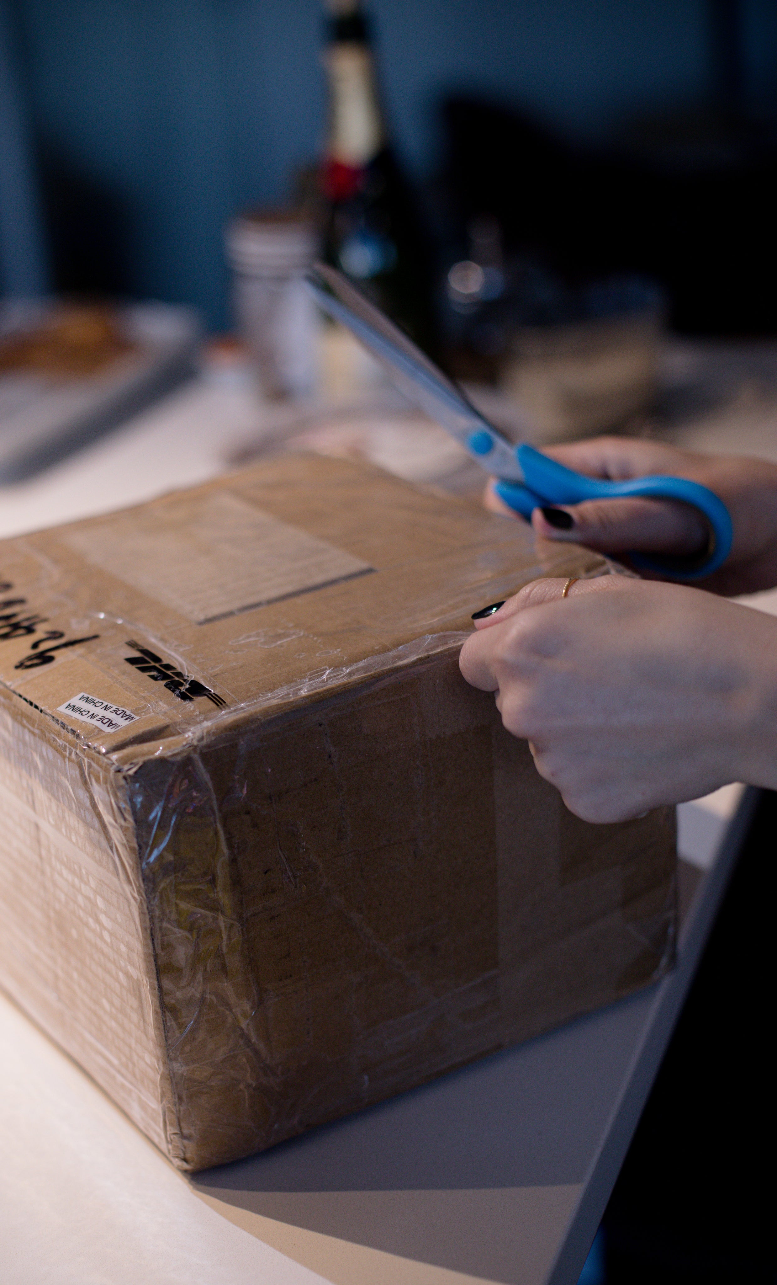 A box being taped and prepped for shipping, showcasing the packing process for secure delivery. Ideal for e-commerce businesses, this image demonstrates the careful preparation of items to ensure safe and efficient shipping, with attention to detail for protection during transit.