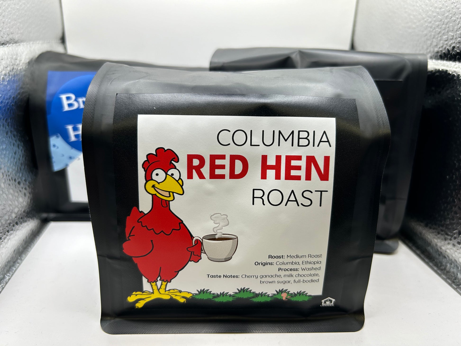 Columbia Red Hen Roast coffee package with a cartoon red hen on a white background