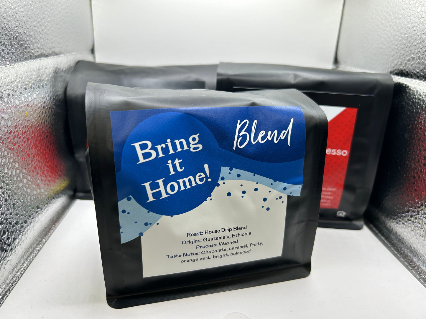 Coffee package labeled 'Bring it Home Blend' on a textured surface