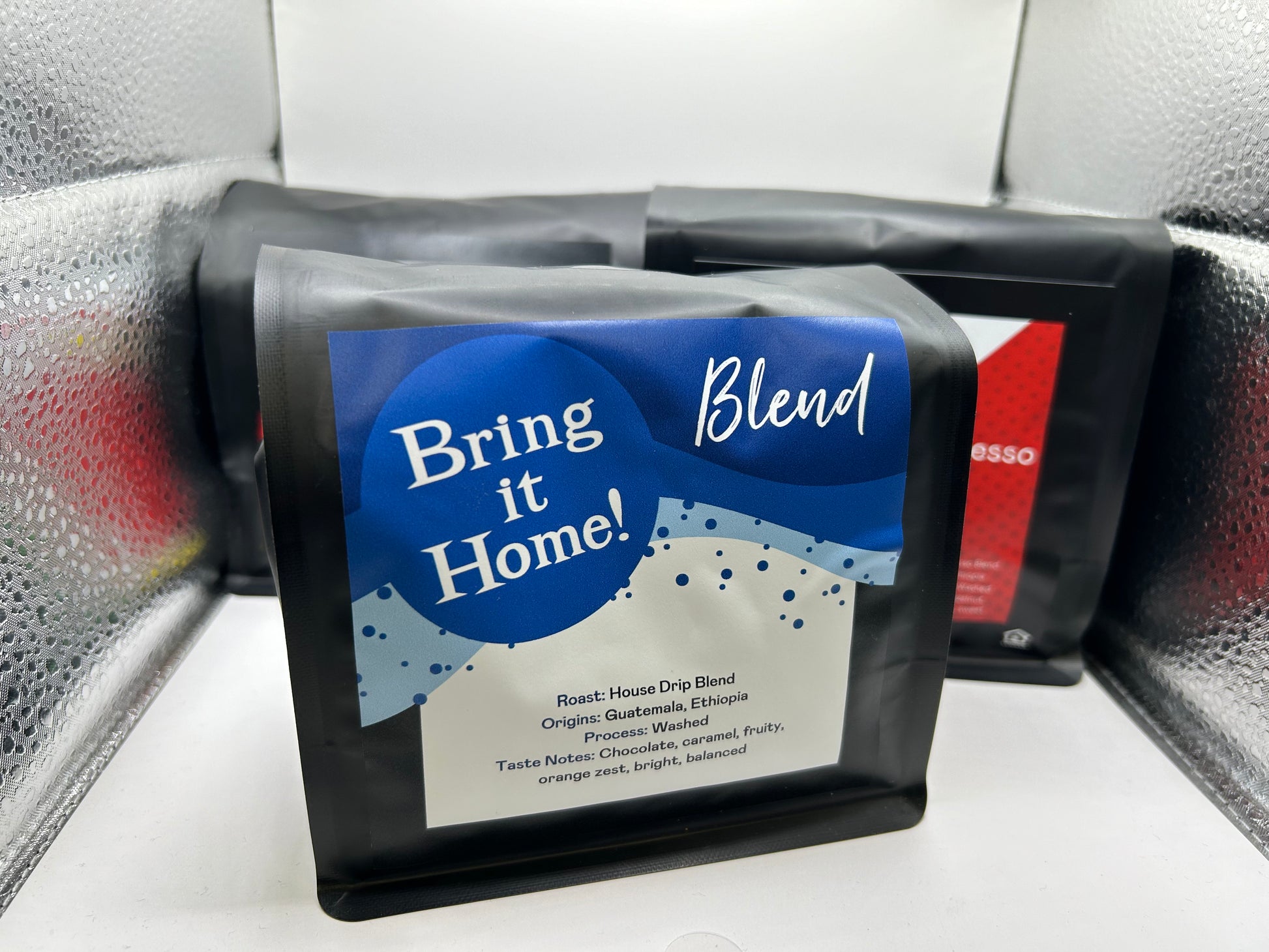 Coffee package labeled 'Bring it Home Blend' on a textured surface