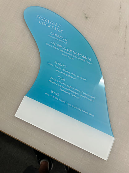 Blue and white menu on a wooden surface