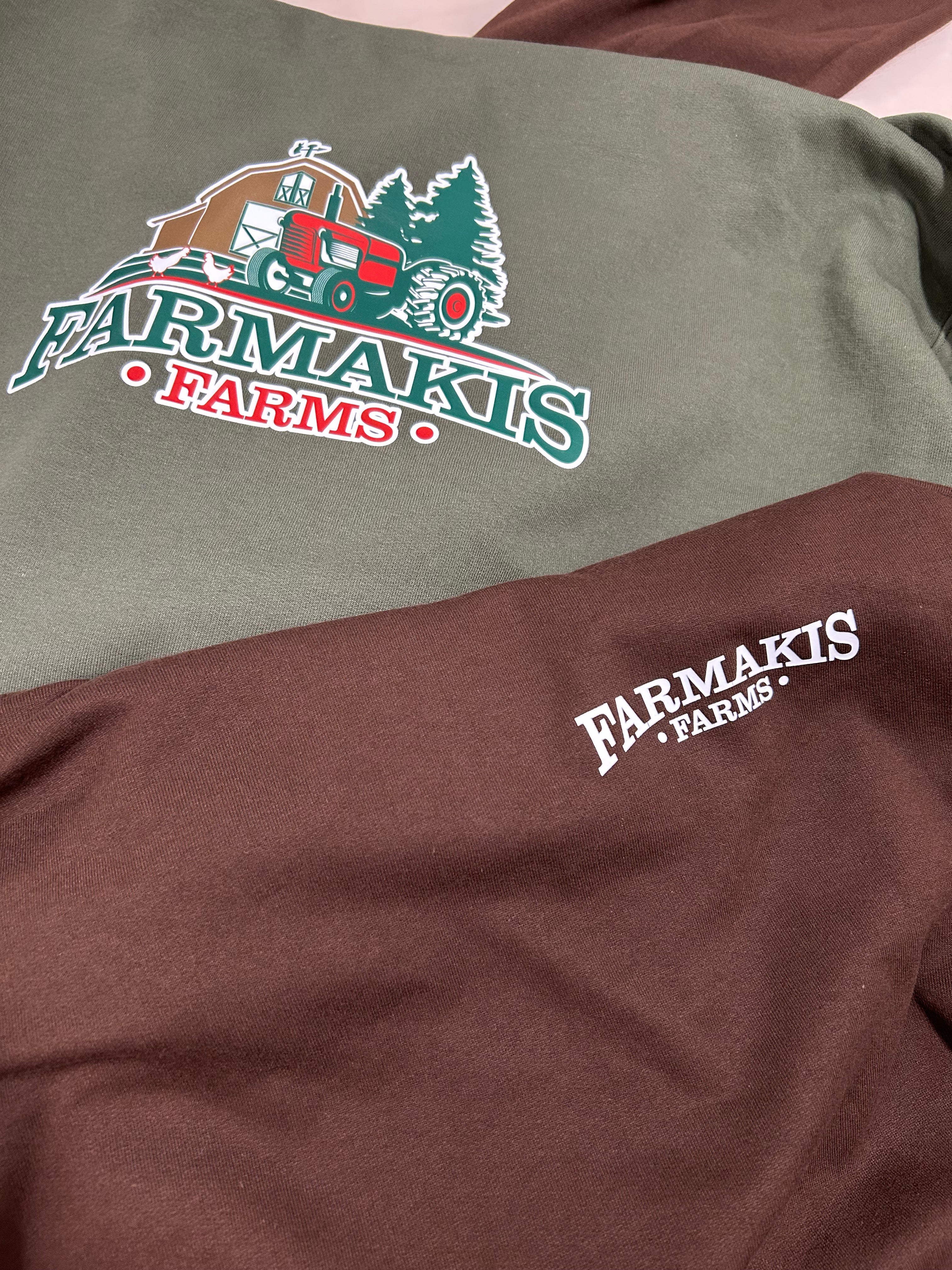Two shirts with Farmakis Farms logo on a plain background