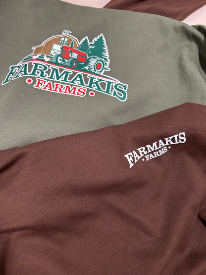 Two shirts with Farmakis Farms logo on a plain background