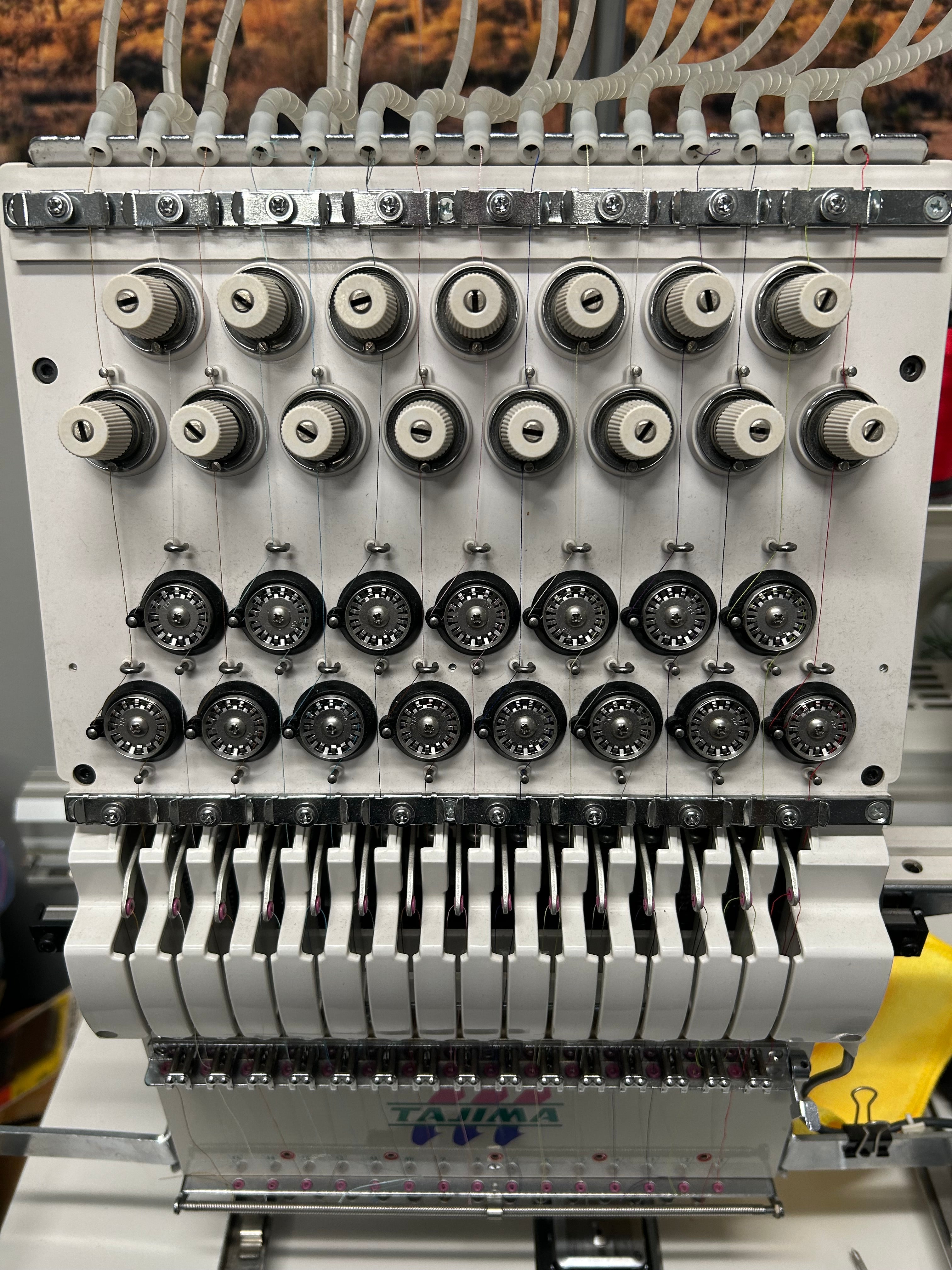 Industrial machine component with multiple cylindrical parts on a metallic background