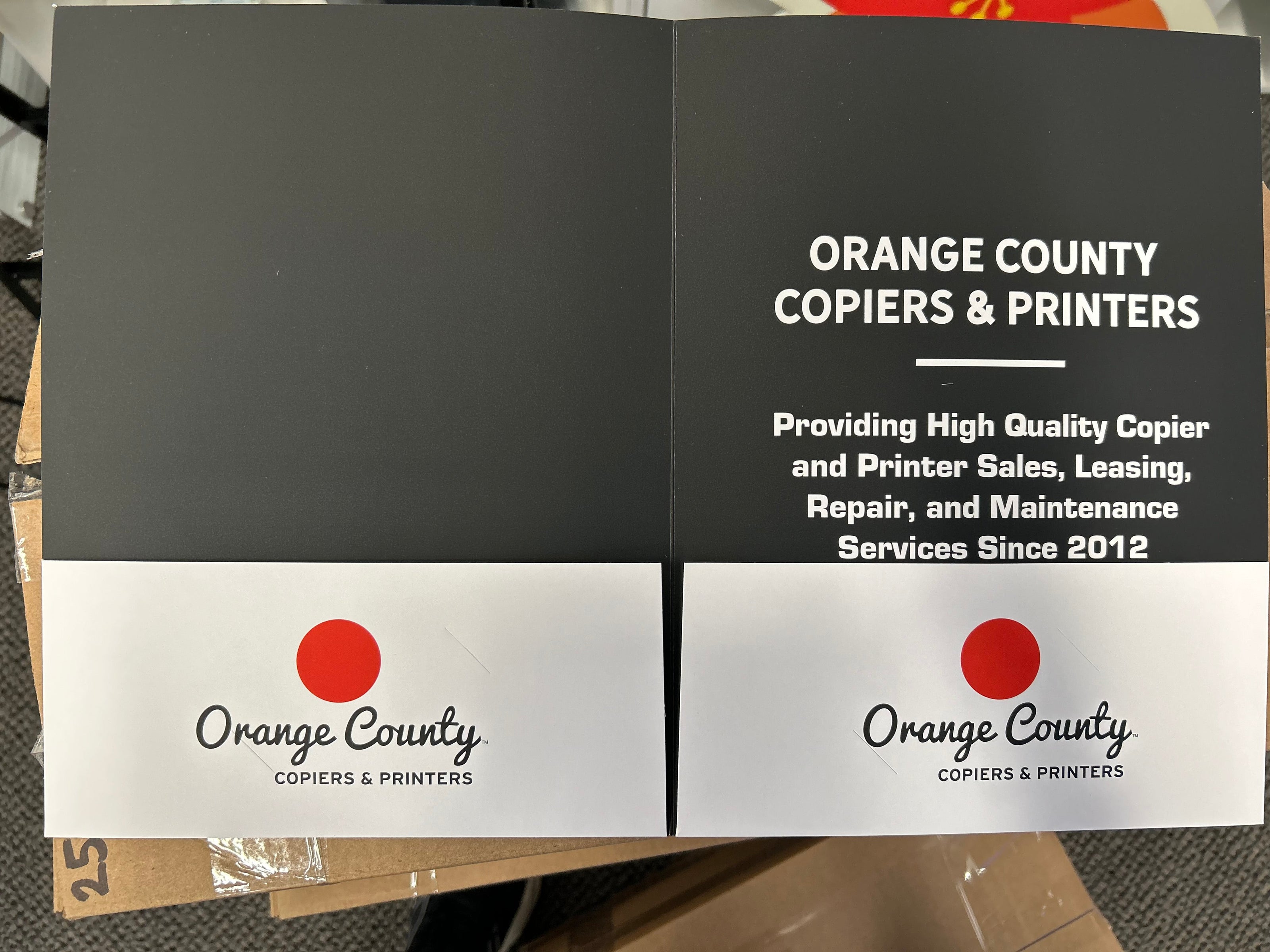 Brochure for Orange County Copiers & Printers with branding and services listed.