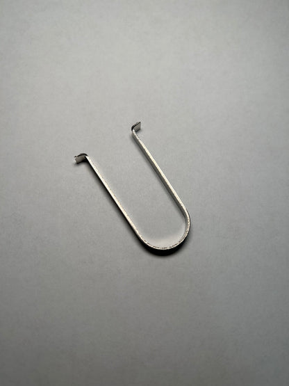 Metal hook on a gray background