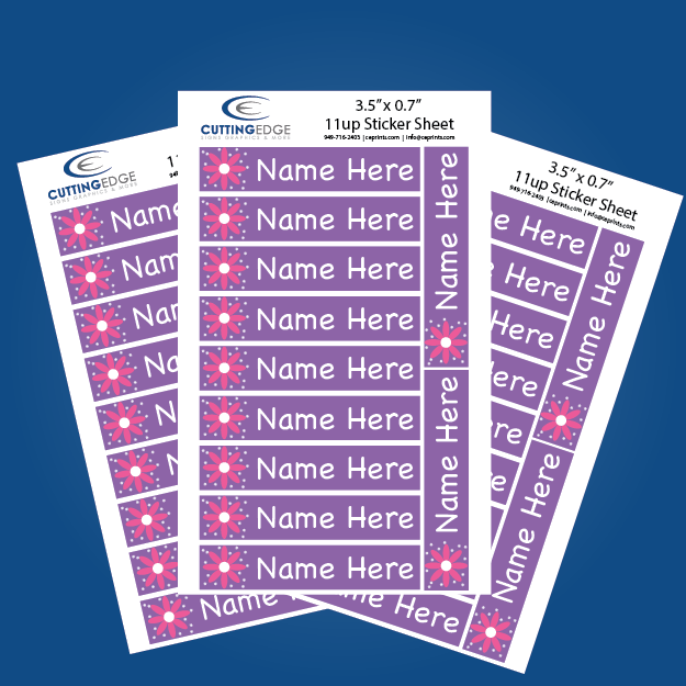 Sheets of personalized name labels with a purple and pink design on a blue background