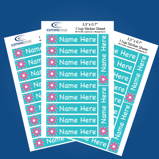 Sheet of personalized name labels with floral designs on a blue background