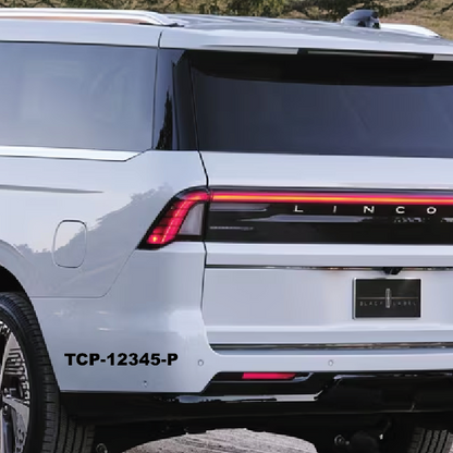 Back view of a white Lincoln vehicle with visible model name and license plate.