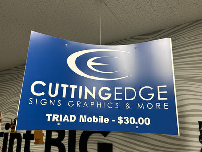 A custom ceiling mobile kit with a blue sign that reads 'CUTTING EDGE SIGNS GRAPHICS & MORE TRIAD Mobile - $30.00' suspended from the ceiling.